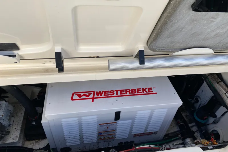 Slide: The Image of 2021 Boston Whaler 345 Conquest engine compartment with Westerbeke generator. - 37