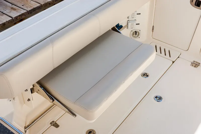 Slide: The Image of Manufacturer Provided Image: Foldable seat on the 2021 Boston Whaler 345 Conquest boat. - 9
