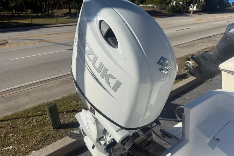 Slide: The Image of 2003 Sea Pro SV2100CC Bay Boat with Suzuki outboard motor on display. - 11