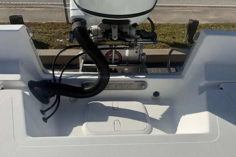 Slide: The Image of 2003 Sea Pro SV2100CC Bay Boat engine area with visible components. - 12