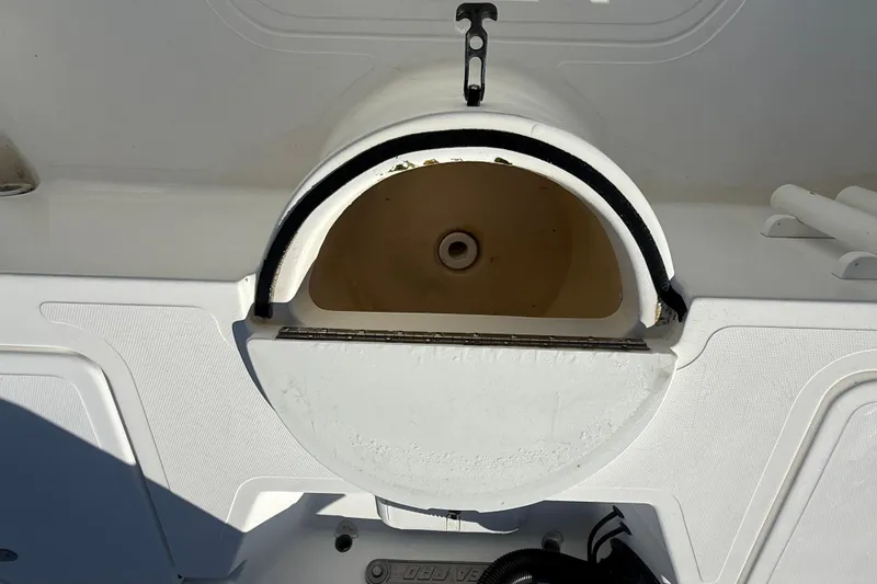 Slide: The Image of 2003 Sea Pro SV2100CC Bay Boat livewell with open lid, showcasing interior details. - 14