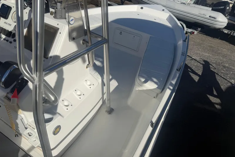 Slide: The Image of 2003 Sea Pro SV2100CC Bay Boat with console and seating area. - 23