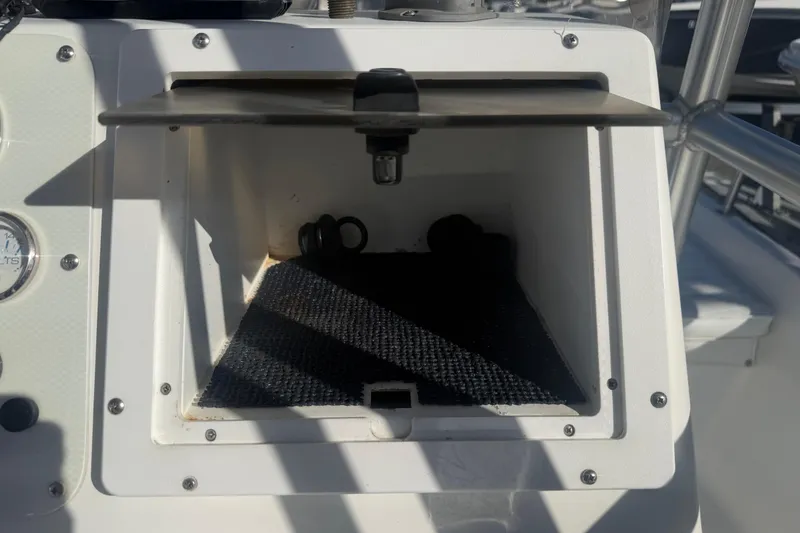 Slide: The Image of Open storage compartment on 2003 Sea Pro SV2100CC Bay Boat console. - 26