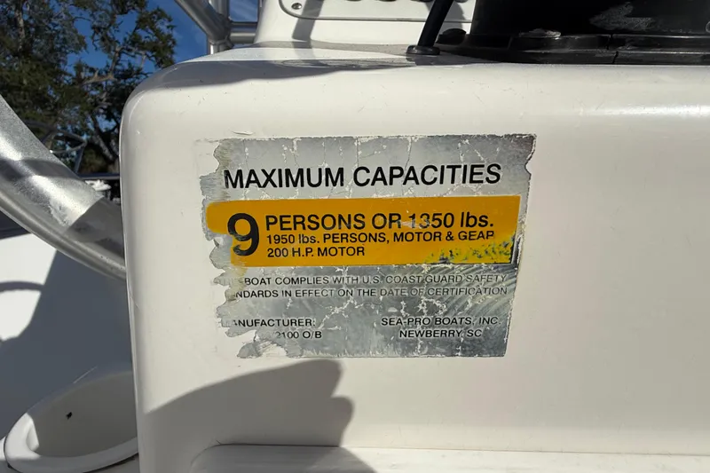 Slide: The Image of 2003 Sea Pro SV2100CC Bay Boat capacity label, 9 persons or 1350 lbs. - 28