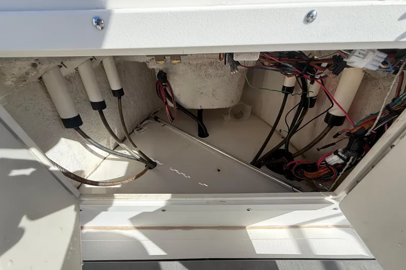 Slide: The Image of 2003 Sea Pro SV2100CC Bay Boat wiring compartment with cables and connectors. - 29
