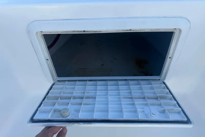 Slide: The Image of Open storage compartment on a 2003 Sea Pro SV2100CC Bay Boat. - 32