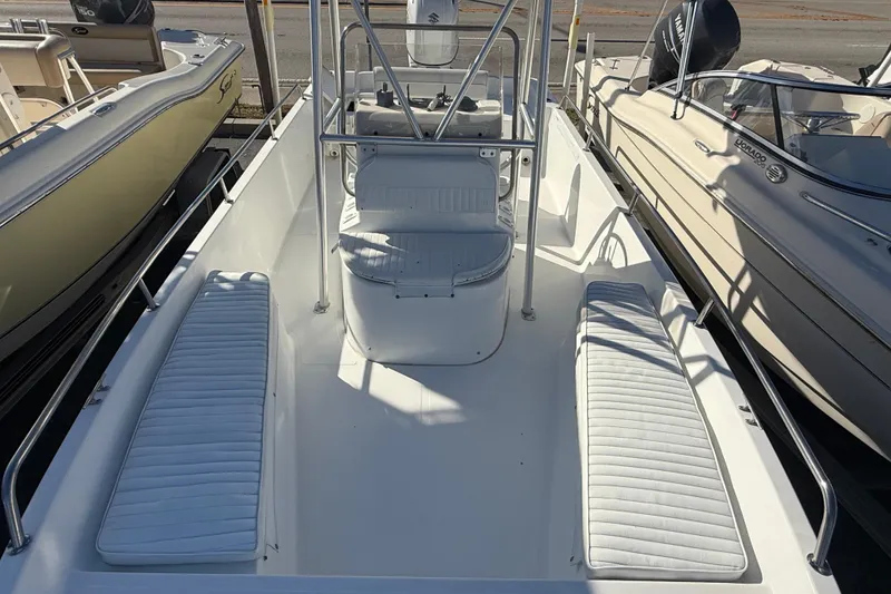 Slide: The Image of 2003 Sea Pro SV2100CC Bay Boat with white seating and center console. - 35
