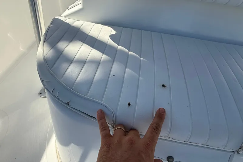 Slide: The Image of 2003 Sea Pro SV2100CC Bay Boat seat with visible wear and tear. - 37