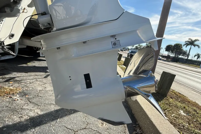 Slide: The Image of 2003 Sea Pro SV2100CC Bay Boat outboard motor and propeller in sunny outdoor setting. - 6