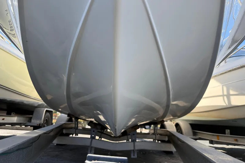 Slide: The Image of 2003 Sea Pro SV2100CC Bay Boat on trailer, close-up view of hull. - 7