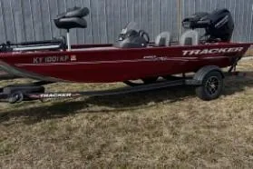 Slide: The Image of 2023 Tracker Pro 170 boat on trailer, parked on grass. - 3