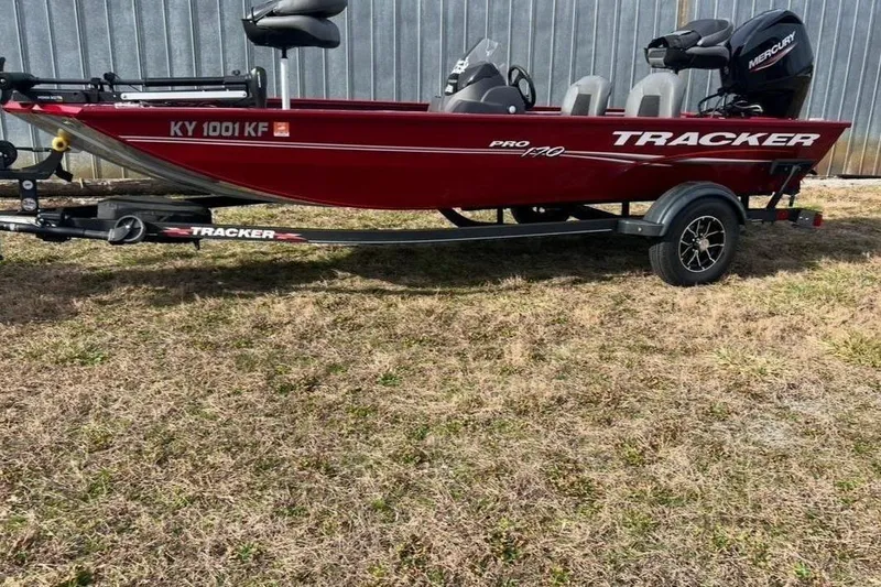 Slide: The Image of Red 2023 Tracker Pro 170 boat on trailer outdoors. - 5