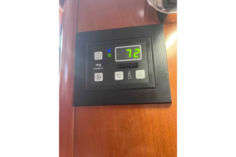 Slide: The Image of Interior cabin view of a 2007 Beneteau 393 sailboat with ceiling hatch and lighting. - 13