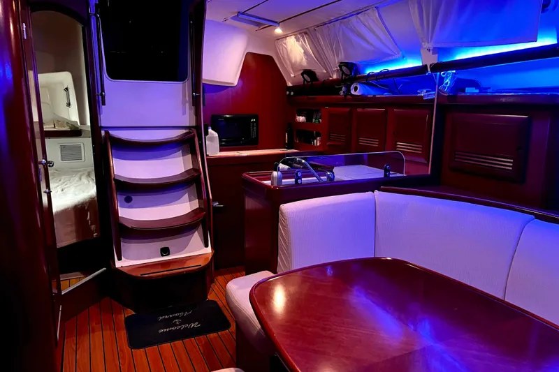 Slide: The Image of Engine compartment of a 2007 Beneteau 393 sailboat, showcasing mechanical components and wiring. - 20