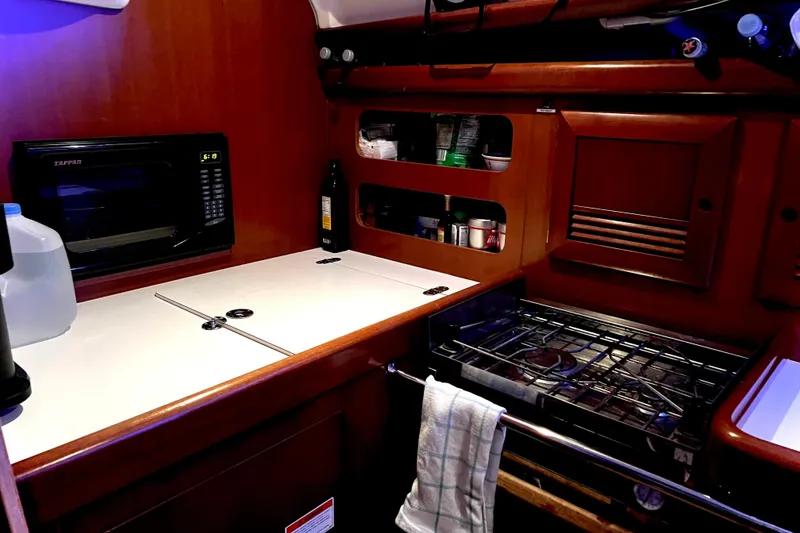 Slide: The Image of Engine compartment of a 2007 Beneteau 393 sailboat, showing hoses and wiring. - 22