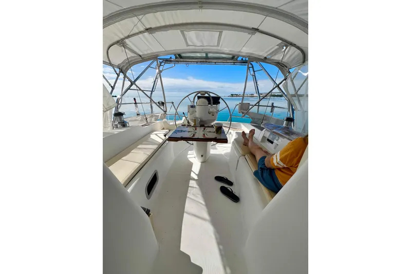 Slide: The Image of Interior of 2007 Beneteau 393 yacht with keyboard and laptop setup. - 26