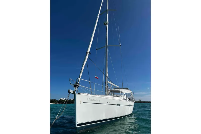 Slide: The Image of Sailing yacht Beneteau 393, 2007 model, anchored in clear blue waters under a sunny sky. - 30