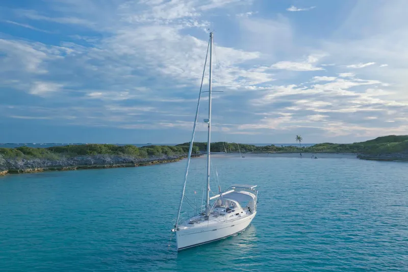 Slide: The Image of Interior view of a 2007 Beneteau 393 sailboat cockpit with a person relaxing. - 31