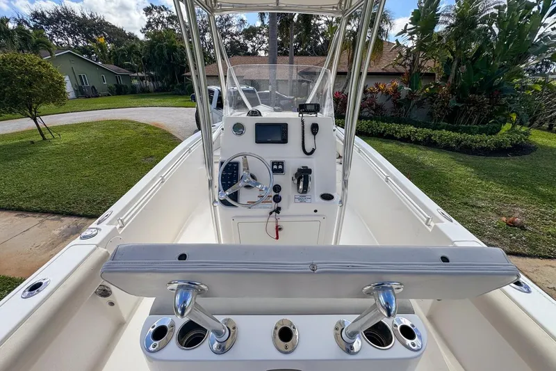 Slide: The Image of 2022 Cobia 220 Center Console boat interior with steering wheel and controls. - 26