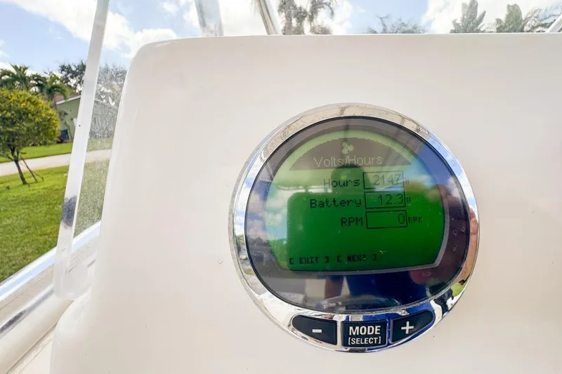 Slide: The Image of Display panel on 2022 Cobia 220 Center Console showing battery and engine hours. - 31