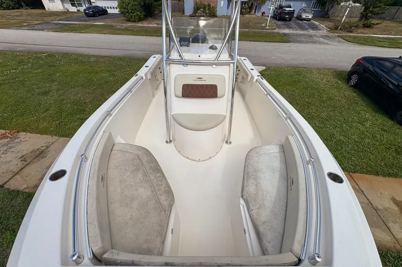 Slide: The Image of 2022 Cobia 220 Center Console boat with spacious seating and sleek design. - 50