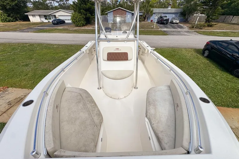 Slide: The Image of 2022 Cobia 220 Center Console boat with spacious seating and sleek design. - 51