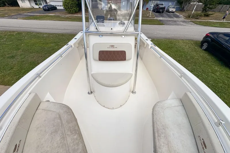Slide: The Image of 2022 Cobia 220 Center Console boat interior with seating and console view. - 54