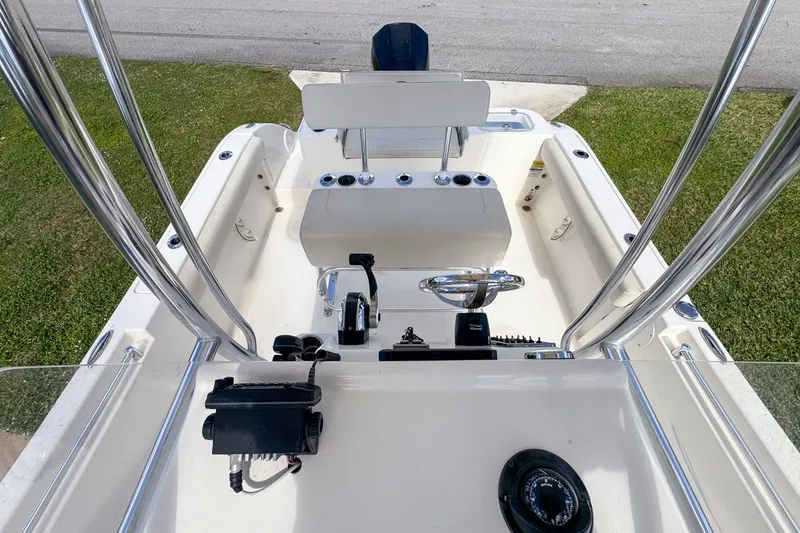 Slide: The Image of 2022 Cobia 220 Center Console boat interior with steering wheel and controls. - 62