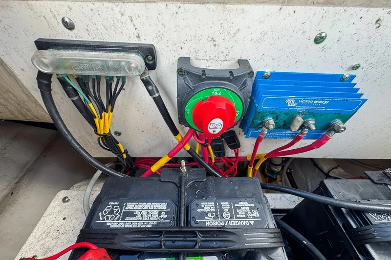Slide: The Image of Electrical system of 2022 Cobia 220 Center Console boat with batteries and wiring. - 81