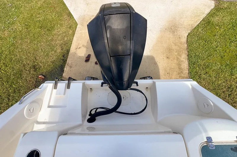 Slide: The Image of 2022 Cobia 220 Center Console boat with outboard motor, viewed from above. - 89