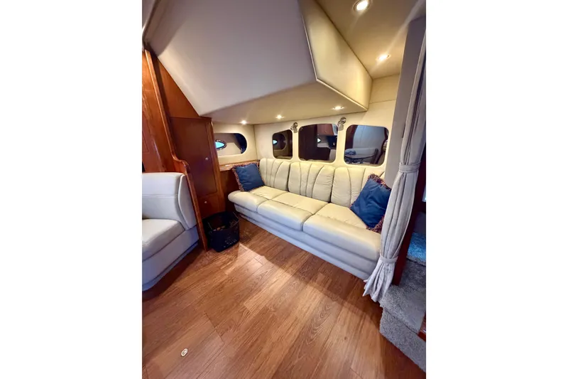 Slide: The Image of Luxurious interior of 2007 Cruisers Yachts 370 Express with plush seating and elegant wood flooring. - 13
