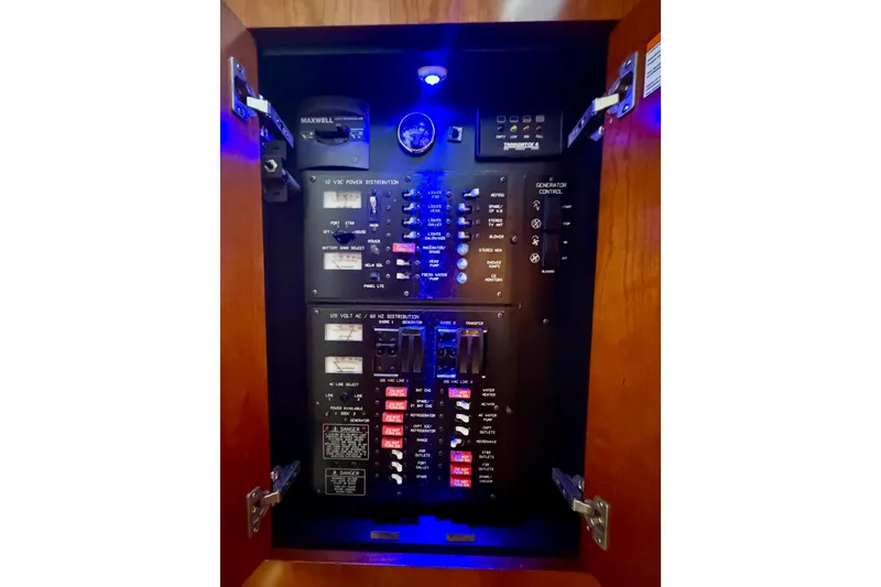 Slide: The Image of Electrical panel inside 2007 Cruisers Yachts 370 Express, featuring various controls and switches. - 16