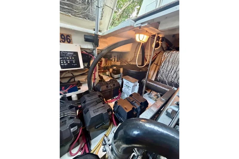 Slide: The Image of Engine compartment of 2007 Cruisers Yachts 370 Express with batteries and wiring. - 23