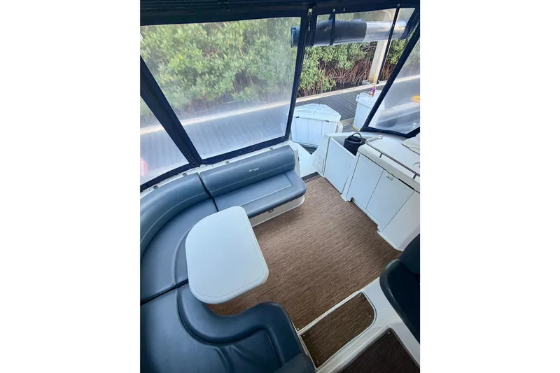 Slide: The Image of 2007 Cruisers Yachts 370 Express interior with seating and table, featuring modern design. - 8