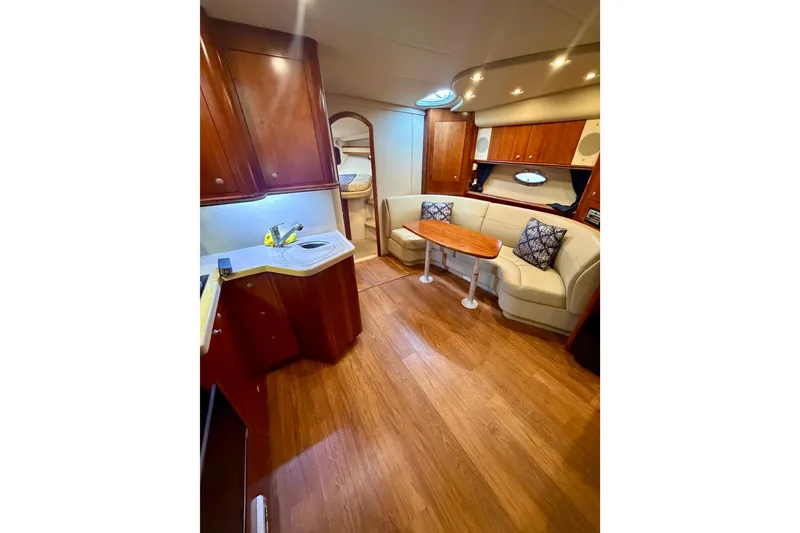 Slide: The Image of Interior of 2007 Cruisers Yachts 370 Express with wood flooring and cozy seating area. - 9