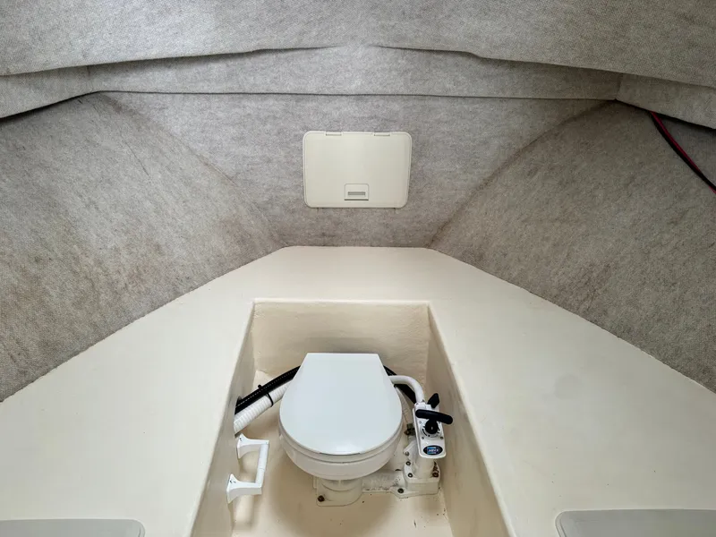 Slide: The Image of Interior of 2002 Parker 2520 XL Sport Cabin with toilet. - 12