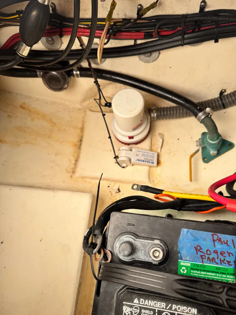 Slide: The Image of Interior of a Parker 2520 XL Sport Cabin with battery and wiring. - 13
