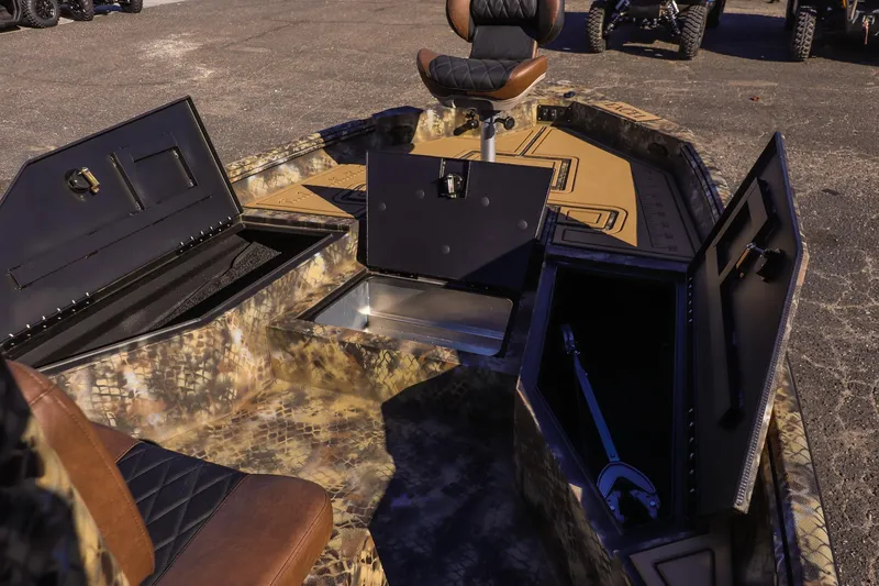 Slide: The Image of 2026 Excel 220 Bay Pro Elite boat interior with open storage compartments. - 10