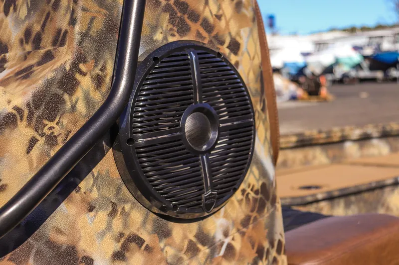 Slide: The Image of 2026 Excel 220 Bay Pro Elite boat with camo design and speaker detail. - 12