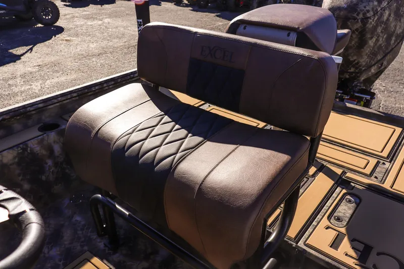Slide: The Image of 2026 Excel 220 Bay Pro Elite boat seat with brown leather upholstery. - 15