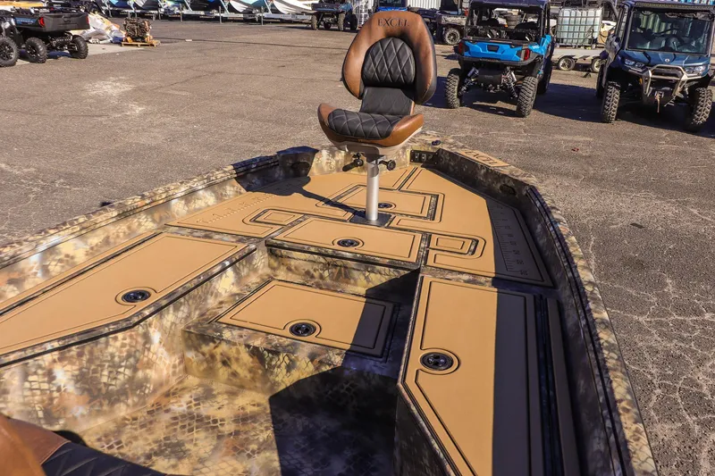 Slide: The Image of 2026 Excel 220 Bay Pro Elite boat with camo design and swivel seat. - 16
