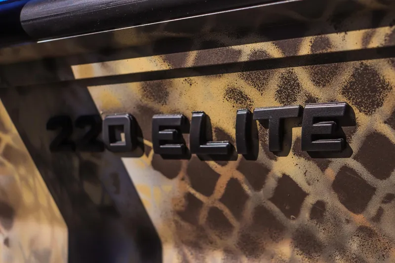 Slide: The Image of 2026 Excel 220 Bay Pro Elite boat with camouflage pattern and bold lettering. - 19