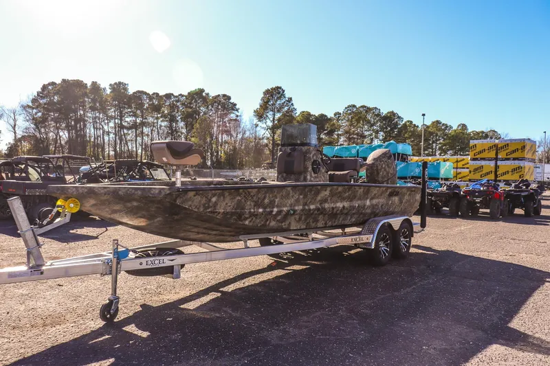 Slide: The Image of 2026 Excel 220 Bay Pro Elite boat on trailer in outdoor dealership lot. - 6