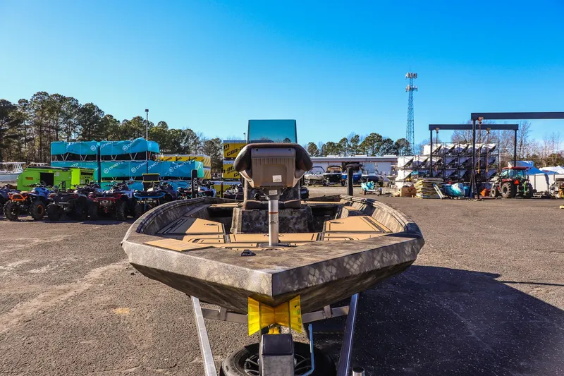 Slide: The Image of 2026 Excel 220 Bay Pro Elite boat in outdoor storage facility. - 7