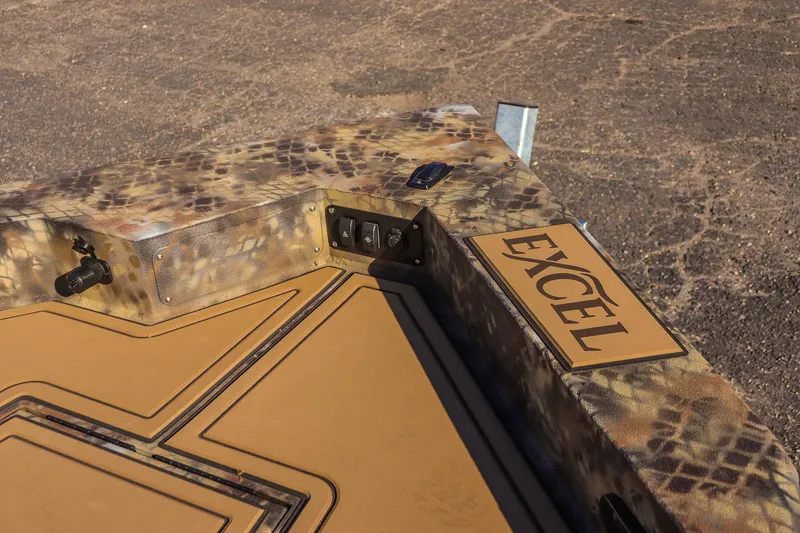 Slide: The Image of 2026 Excel 220 Bay Pro Elite boat with camouflage design and logo detail. - 9