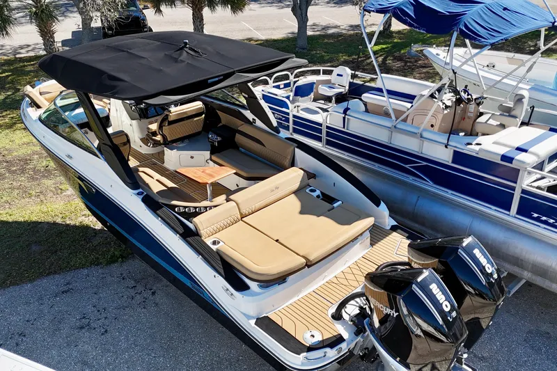 The Image of 2024 Sea Ray SLX 280 Outboard boat with spacious seating and dual Mercury engines. - 0