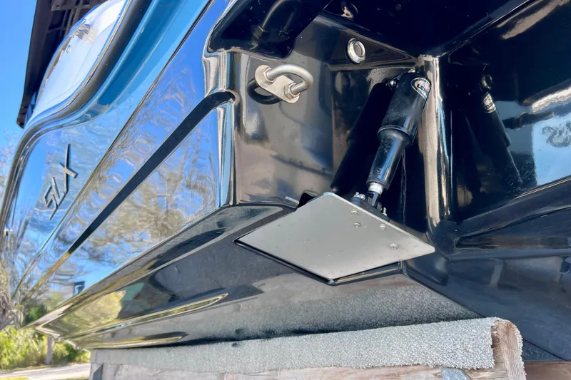 Slide: The Image of 2024 Sea Ray SLX 280 Outboard, close-up of sleek black hull and trim tab. - 17