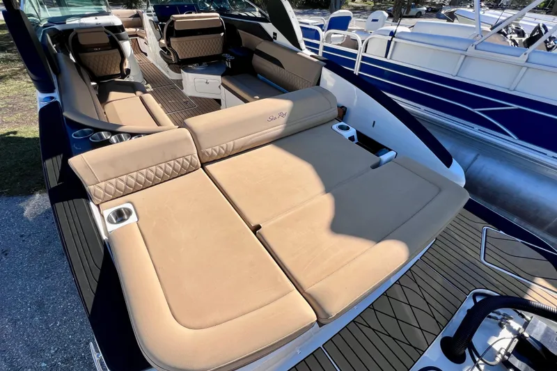 Slide: The Image of 2024 Sea Ray SLX 280 Outboard with luxurious seating and spacious deck layout. - 18