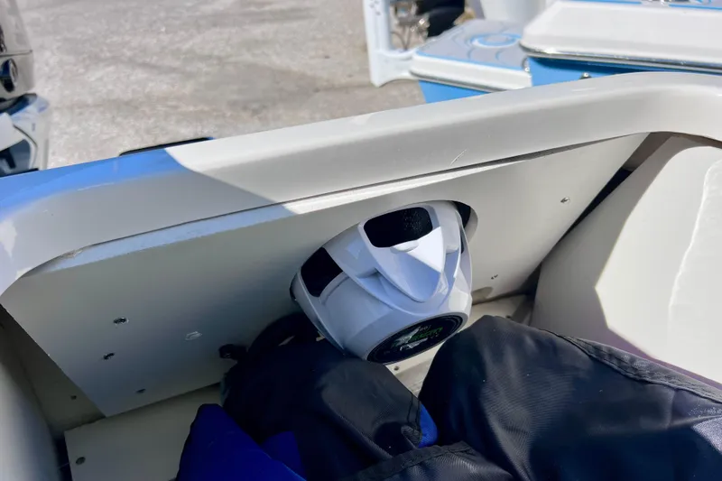 Slide: The Image of 2024 Sea Ray SLX 280 Outboard boat interior detail with speaker and seating area. - 23