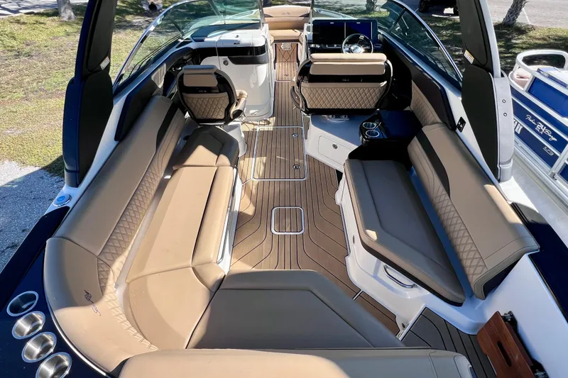 Slide: The Image of 2024 Sea Ray SLX 280 Outboard interior with luxurious seating and modern design. - 24